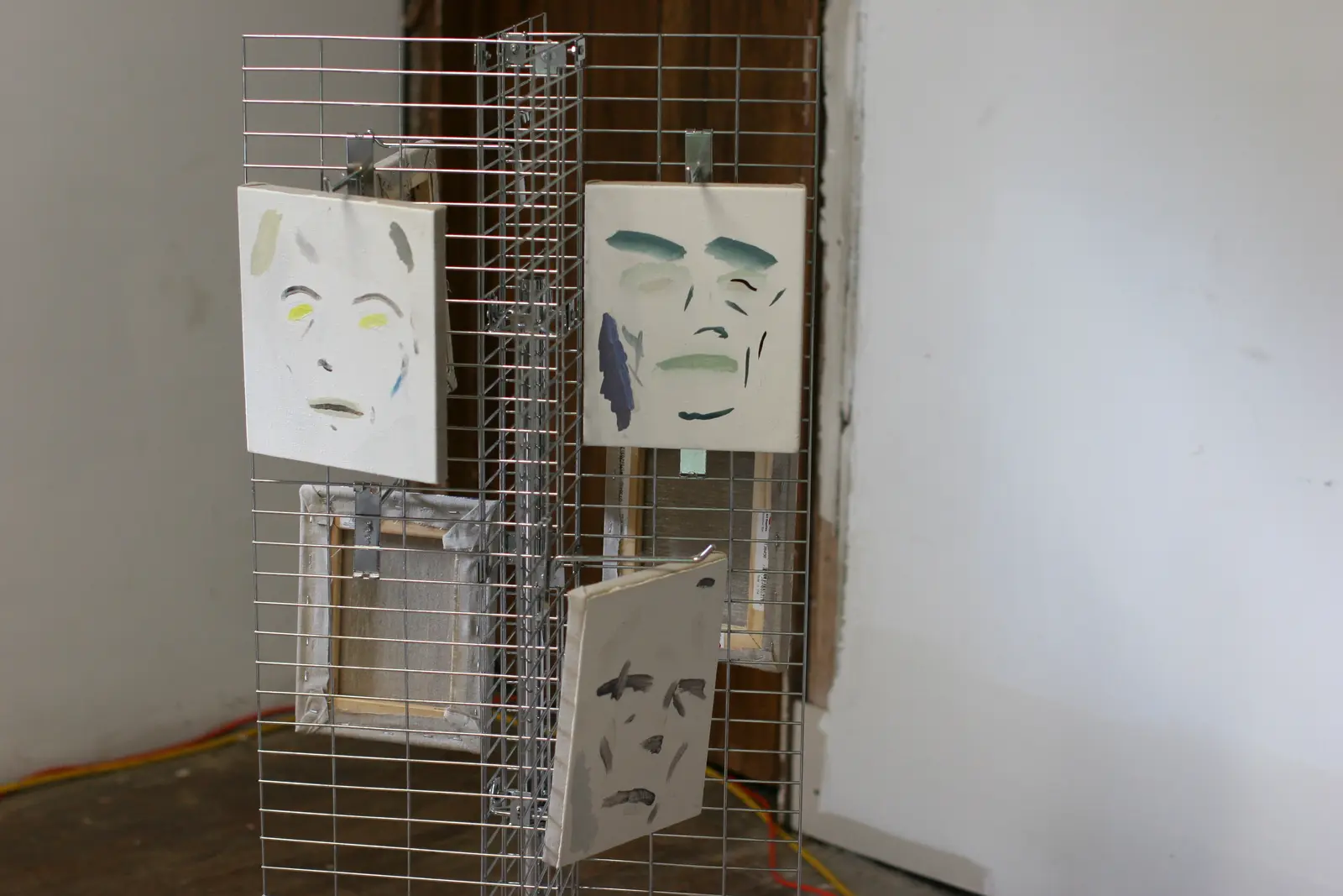 Grid display with ego drift portrait works